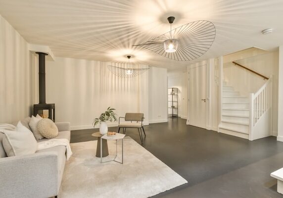 Interior of contemporary living room with comfortable sofa and wooden table in flat
